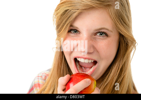 Teenage girl eating healthy apple isolated on white background Stock Photo