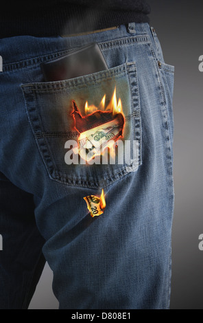 Dollars burning hole in pocket Stock Photo