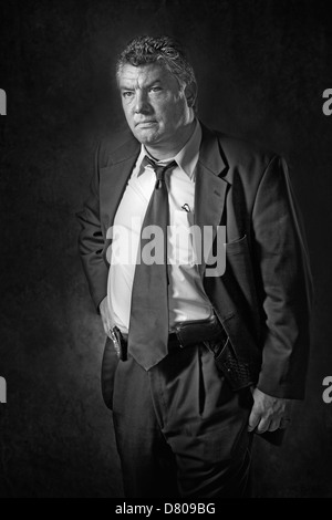 Greek businessman with hand on hip Stock Photo