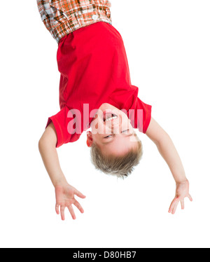 kid boy upside down isolated on white Stock Photo