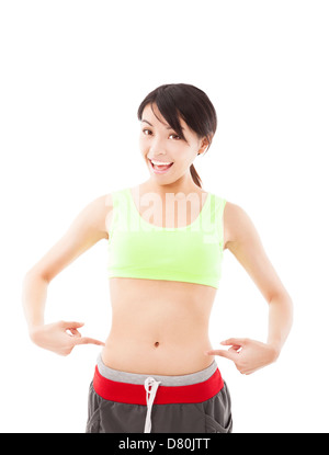 happy young woman doing exercise and point his waist Stock Photo