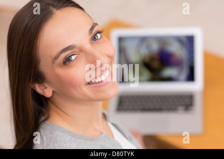 Female looking at pictures on her computer Stock Photo