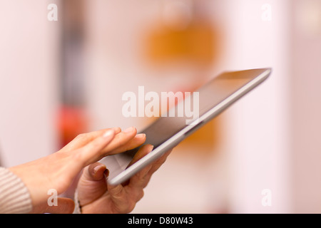 Woman holding digital tablet, closeup Stock Photo