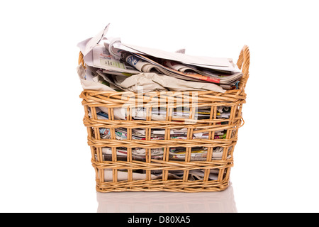 Full wastepaper basket isolated on white background Stock Photo