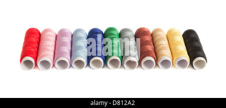Colorful thread spools isolated on white background Stock Photo