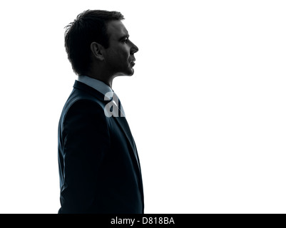 one  business man serious portrait profile in silhouette studio isolated on white background Stock Photo
