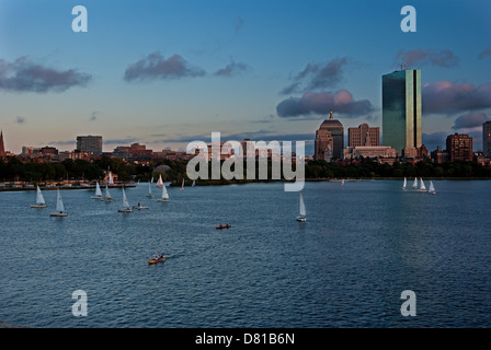 Sailboats in the foreground point towards the Boston skyline Stock Photo