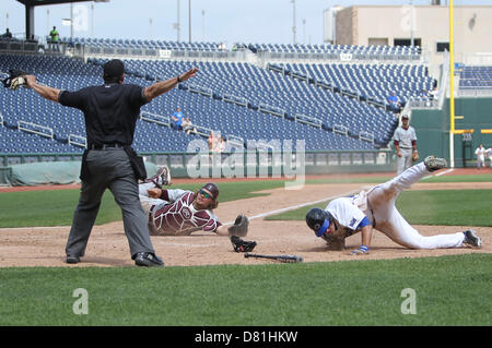 Luke Voit #30 of the Missouri State Bears follows through his swing after  making contact on a pitch during a game against the Wichita State Shockers  at Hammons Field on May 5