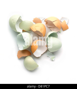 Pile of broken eggshells cut out onto a white background Stock Photo