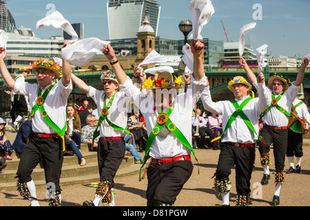 The Woodside Morris Men from Watford perform on the Thames Embankment, London, UK. Stock Photo