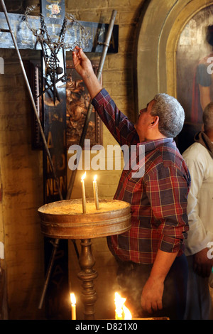 christian pilgrim in coptic St. Mari Girgis Church, Cairo Egypt Stock Photo