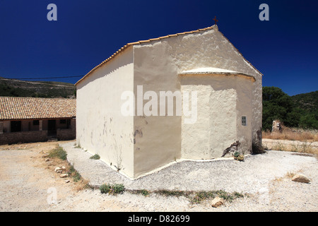 Church in the ruined deserted village of Paleo Perithia, north east Corfu Island, Greece. Stock Photo
