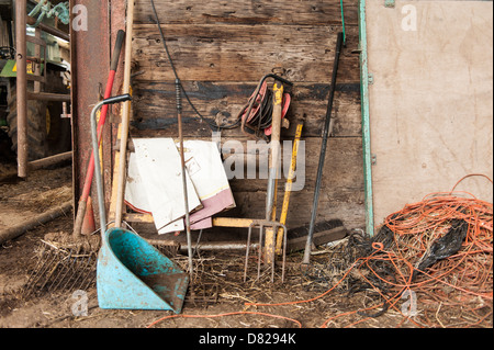 Farm tools and equipment in barn, Vowley Farm, Royal Wootton Bassett, Wiltshire. Stock Photo