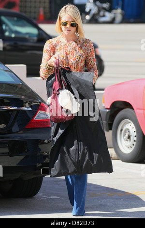 Ali Larter leaves a clothing tailor in Beverly Hills carrying a Chanel dress bag Los Angeles, California - 17.02.12 Stock Photo