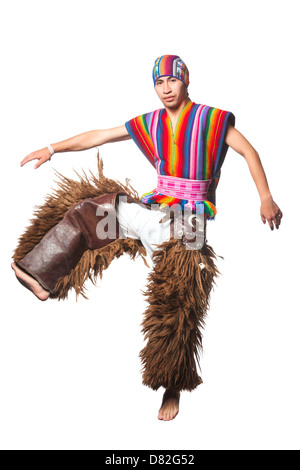 A man is captured mid-motion in a dynamic dance pose, wearing vibrant traditional clothing. He is barefoot and dressed in a sleeveless, vertically striped vest with bright rainbow colors, a matching Stock Photo