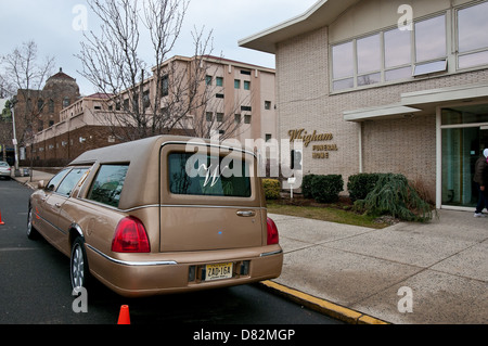 The hearse which carried Whitney houston's body to Whigham Funeral Home ...