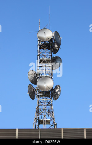 Telecommunication tower with many different antennas Stock Photo