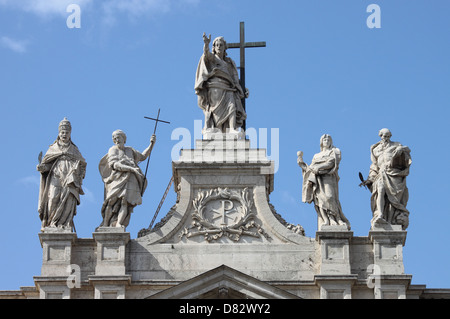 Statues of Christ and some saints on the top of Saint John Lateran Basilica facade. Rome, Italy Stock Photo