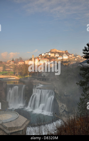 Waterfalls at the confluence of rivers Pliva and Vrbas with the Old Town in the background, Jajce, Bosnia and Herzegovina Stock Photo