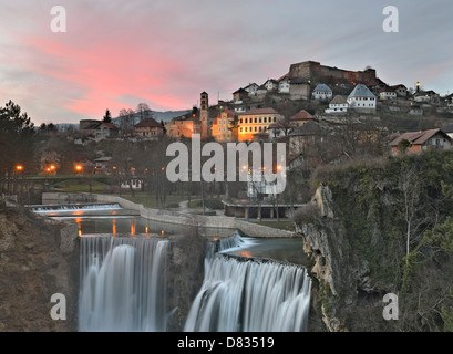 Waterfalls at the confluence of rivers Pliva and Vrbas with the Old Town in the background, Jajce, Bosnia and Herzegovina Stock Photo
