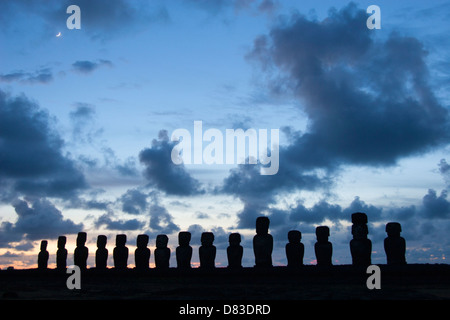 Ahu Tongariki at dawn, Easter Island's largest ahu (platform) with 15 moai restored in the 1990s after falling during civil wars and tsunami. Stock Photo