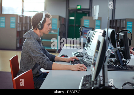 student working at the computer in the library Stock Photo