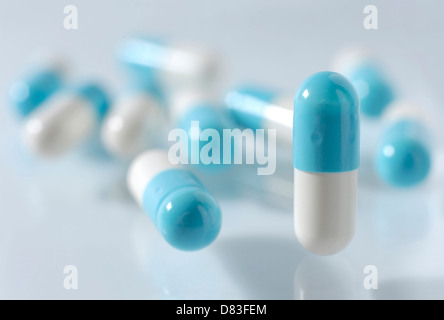 White-blue capsules Medication pills isolated on white background Stock Photo