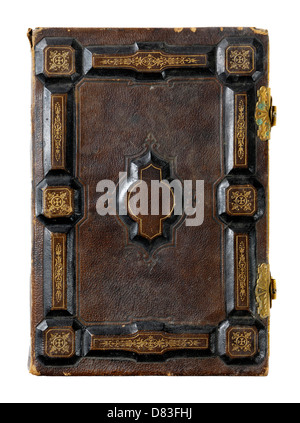 Closeup of rustic ancient book with hard ornamental leather cover Isolated silhouette on white background Stock Photo