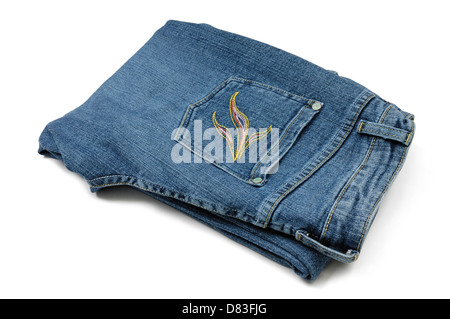 Folded blue womens jeans closeup Isolated silhouette on white background Stock Photo