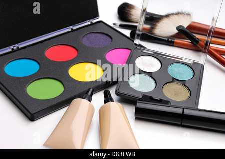 Colorful eyeshadow palettes, make-up brushes and other makeup accessories still life. Stock Photo