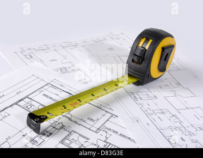 Tape measure on construction plans of a house Stock Photo