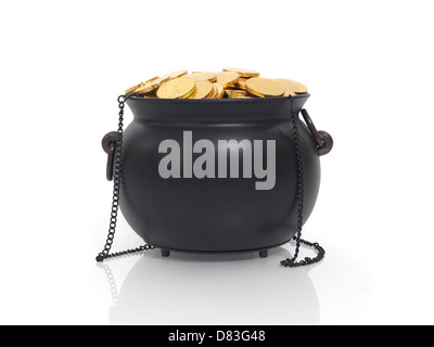 Cauldron full of money, fake golden loonie coins. Isolated on white background. Stock Photo