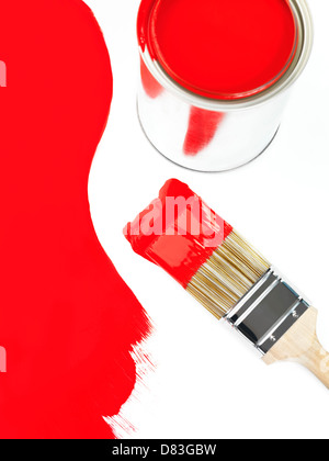 Open can of red pain and a paint brush artistic still ife. Painting and renovation concept. Stock Photo