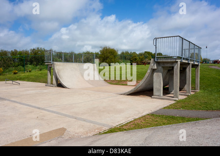 View of a skate park within a public playground in the UK. Stock Photo