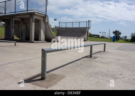 View of a skate park within a public playground in the UK. Stock Photo