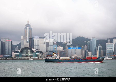 Container ship sails through Victoria Harbour, Hong Kong Stock Photo