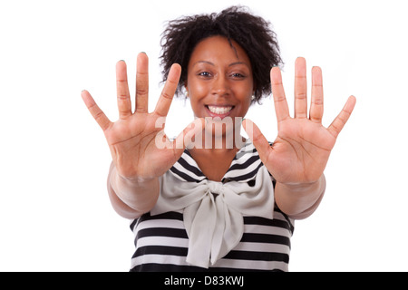 Young black woman showing her hands palm, isolated on white background - African people Stock Photo