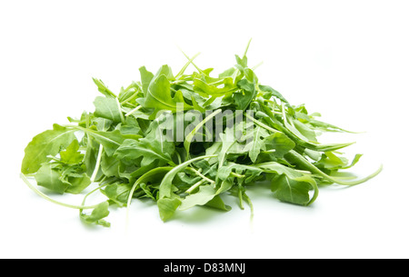 heap of rucola leaves isolated on white background Stock Photo
