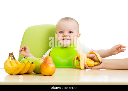 mother feeding baby girl Stock Photo