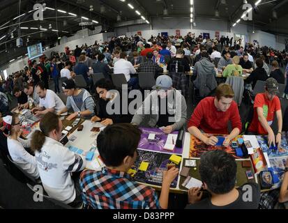 Participants of the German Yu-Gi-Oh! Trading Card Game Championships play against each other in Schkeuditz, Germany, 18 May 2013. More than 800 players competed against each other to win the title of German champion of the Japanese card game. The best 32 players achieved a qualification for the European Championships at the end of June i n Frankfurt (Main). Photo: Hendrik Schmidt/dpa Stock Photo