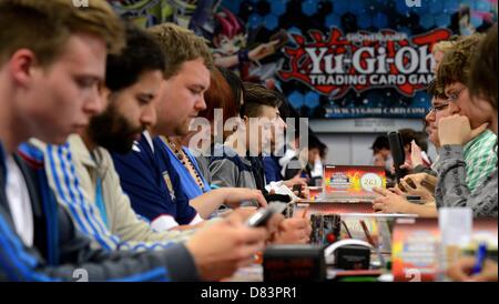 Participants of the German Yu-Gi-Oh! Trading Card Game Championships play against each other in Schkeuditz, Germany, 18 May 2013. More than 800 players competed against each other to win the title of German champion of the Japanese card game. The best 32 players achieved a qualification for the European Championships at the end of June i n Frankfurt (Main). Photo: Hendrik Schmidt/dpa Stock Photo