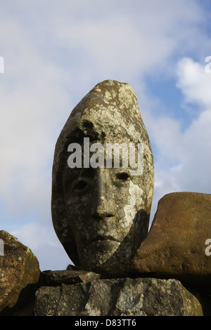 Stone sculpted human faces embedded in a dry stone dyke by Matt Baker, Galloway Forest Park, Dumfries & Galloway, Scotland Stock Photo