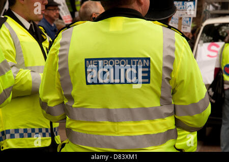 London, UK. 18th May 2013. Police look on as London residents, medical staff, unions and health campaigners protest against closures of Maternity and Accident and Emergency units, the loss of hospital beds and the threat of privatisation in London hospitals. Credit:  Patricia Phillips / Alamy Live News Stock Photo