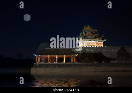 Corner turret of the Forbidden City surrounded by Moat, at night. Beijing, China. Stock Photo