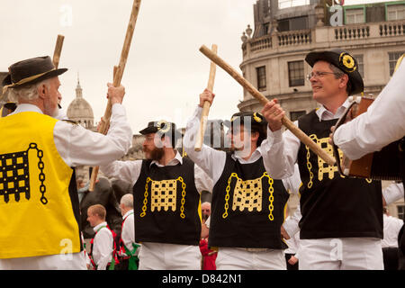 London, UK. 18th May, 2013. Morris dancers perform in Trafalgar Square, as eleven teams from around the country and up to 150 dancers perform at Westminster Day of Dance. The event celebrates the 60th anniversary of the Westminster Morris Men, who first performed on Coronation Day in 1953. Credit: Patricia Phillips/Alamy Live News Stock Photo