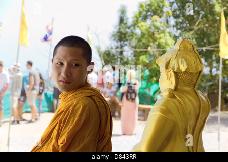 PHUKET, THAILAND FEBRUARY 15 2013: Buddhist monk visits the Big Buddha Monument in Phuket Stock Photo