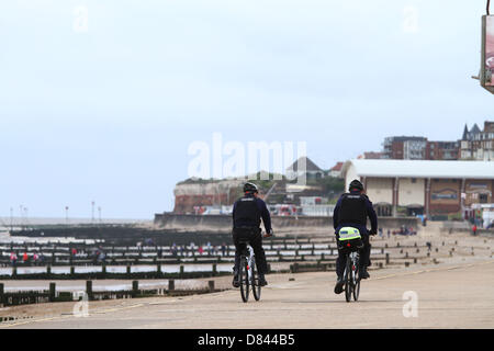 Hunstanton, Norfolk         Weather        May 17, 2013          Two police community support officers patrol on bicycles along the promenade at Hunstanton, Norfolk. Pic: Paul Marriott Photography Stock Photo