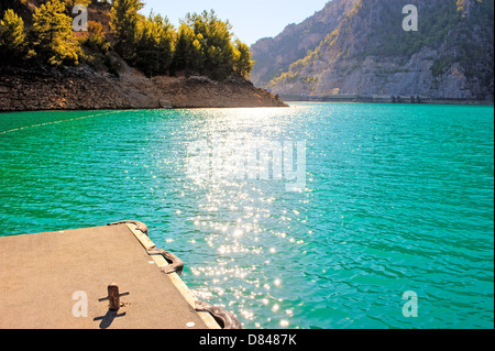 Mountain Lake. Emerald water reservoir behind the dam Oymapinar Stock Photo