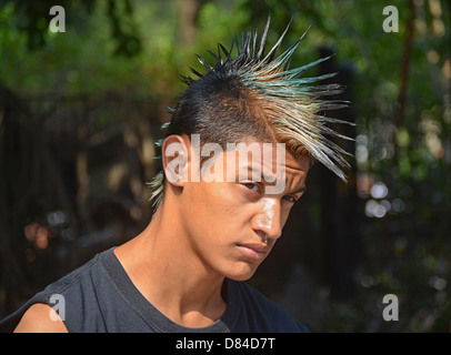 A young man with a Mohawk hairdo and a nose ring in Union Square Park, New York City Stock Photo