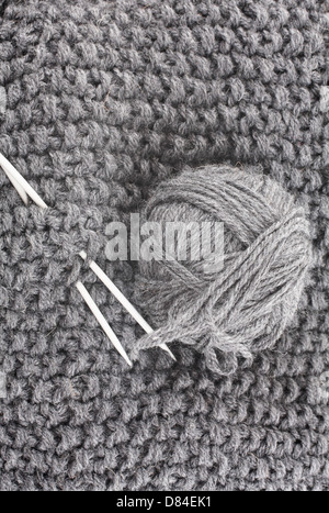 wooden knitting needles on background of grey merino wool blanket Stock  Photo - Alamy